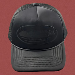Corteiz All-Black Monochromatic Oval Ship Logo Trucker Hat